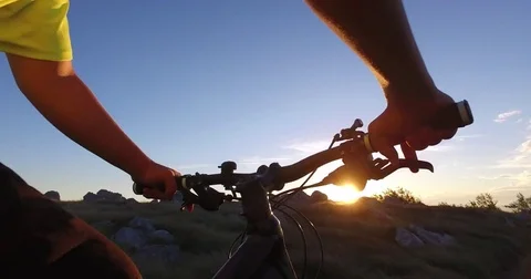 Mountan biking at sunset Stock Footage 82509358