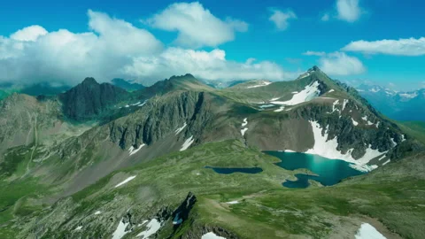 Mountanous landscape with fluffy clouds Stock Footage 160320108