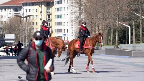 Mounted Cops control corona measures in Taksim and İstiklal Street. Stock Footage 148472814