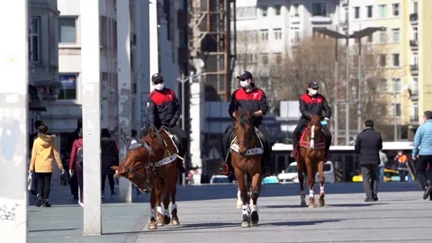 Mounted Cops control corona measures in Taksim and İstiklal Street. Stock Footage 148473071
