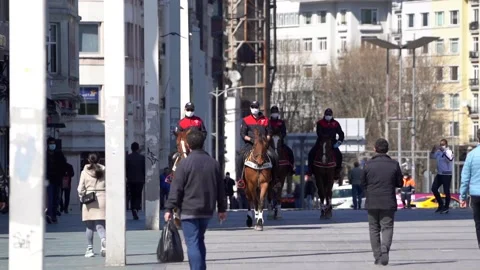 Mounted Cops control corona measures in Taksim and İstiklal Street. Stock Footage 148473278
