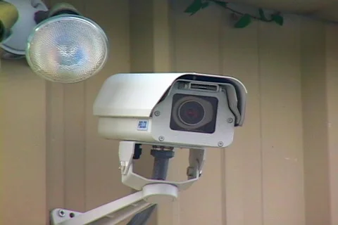 Mounted Security Camera Next To A Fog Light Stock Footage 140987
