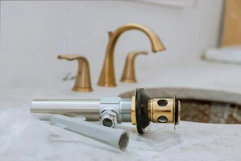 Mounted sewer drain with sink at work in a bathroom Stock Photos