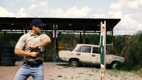 Mounted video. Shooting. A man is practicing tactical shooting with a pistol  Stock Footage 113574652