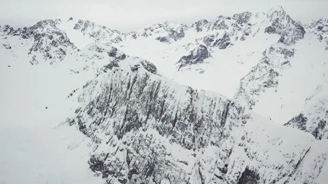 Mountian tops covered with snow in the Austrian Alps. Aerial view. Stock Footage 274568246