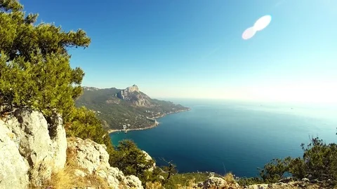Mountine and sea with patch of reflected light Stock Footage 83317661