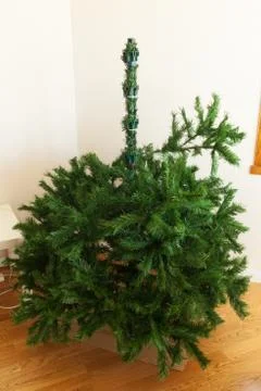 Mounting artificial Christmas tree Stock Photos