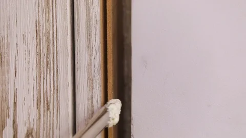 Mounting foam close the door slope Stock Footage 122214285