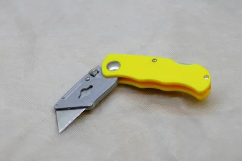 Mounting knife with a replacement blade working background Stock Photos