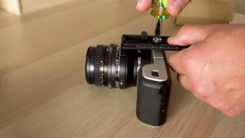 Mounting plates on a camera Stock Footage 138205446