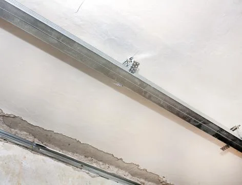 Mounting profile with a false ceiling assembly Stock Photos