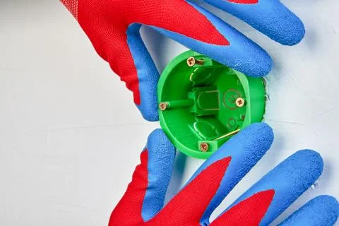 Mounting of round outlet box. Stock Photos