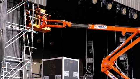Mounting scene using powerful industrial crane. Preparations for concert Stock Footage 124088364