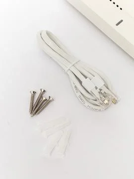 Mounting screws and cable for wireless access point Stock Photos