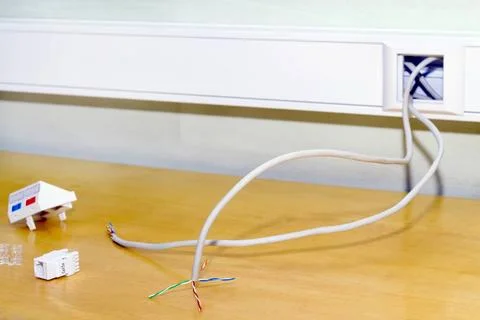 Mounting socket rj 45 internet network Installation of a double socket rj ... Foto stock