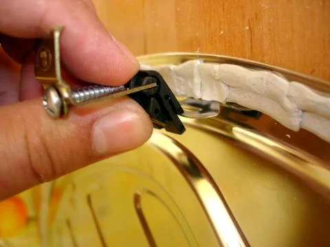 Mounting a Standard Clamping Bracket for a Kitchen Sink With Precision Stock Photos