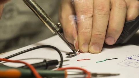 Mounting wires to micro USB electrical component with soldering-iron. Stockbeeldmateriaal 93753195