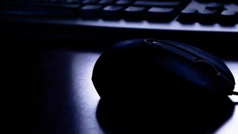 Mouse and keyboard in the dark Stock Photos