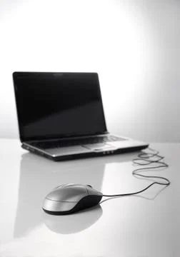 Mouse and laptop Stock Photos