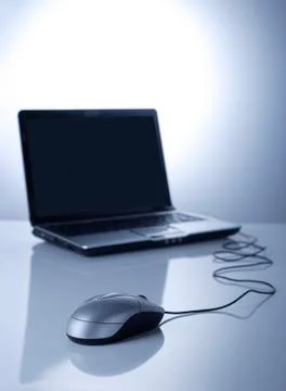 Mouse and laptop Stock Photos