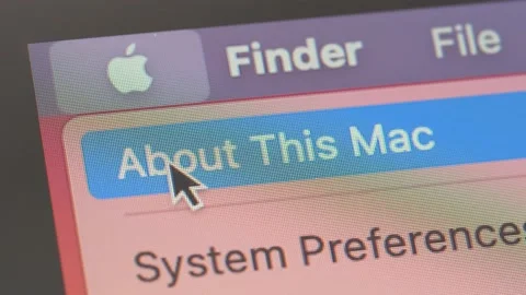 Mouse Clicking on the Apple Icon on a Mac Laptop Computer Stock Footage 148240615