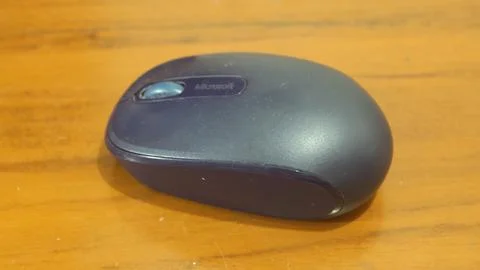 Mouse computer on wood pattern table Stock Photos