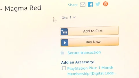 Mouse cursor clicking Add to Cart button, Amazon.com, display. Online shopping Stock Footage 143790002