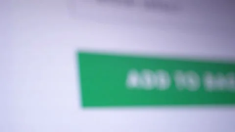 Mouse cursor clicks on the "Add To Bag" button. Macro shot close up of design Stock Footage 196705213