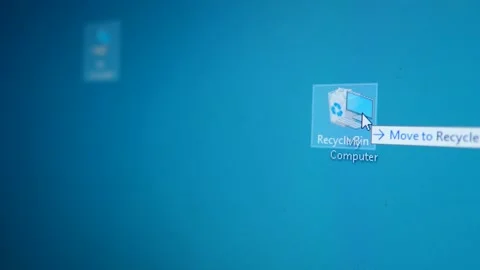 Mouse cursor moves the My Computer icon to the Recycle Bin Stock Footage 234636903