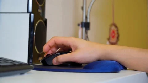 Mouse pads with a gel pad under the wrist. A man hand is working at the computer Video stock 169624616
