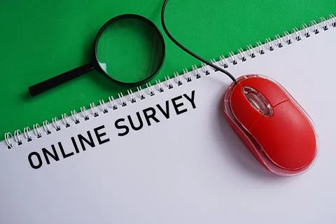 Mouse with printed note ONLINE SURVEY. World Internet Day concept Stock Photos