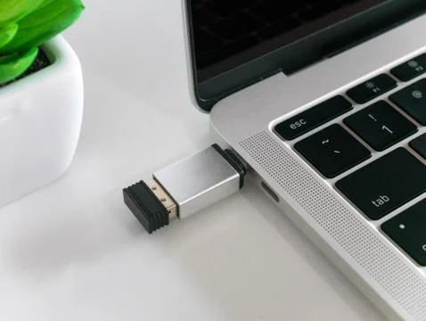 Mouse Wireless Receiver Attached to a Laptop Stock Photos