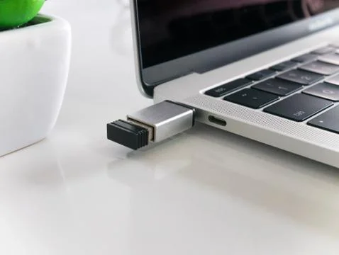 Mouse Wireless Receiver Attached to a Laptop Stock Photos
