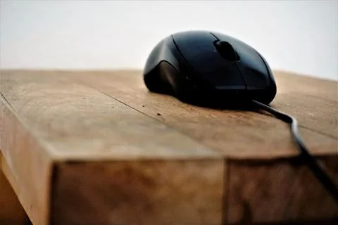 Mouse on wooden table side view Stock Photos