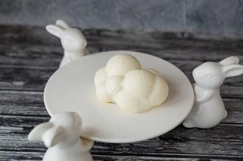 A mousse cake in the form of a delicate white cloud Stock Photos
