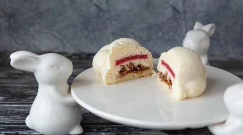 A mousse cake in the form of a delicate white cloud Stock Photos