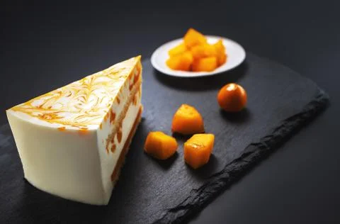 Mousse cake with mango puree and cream Stock Photos