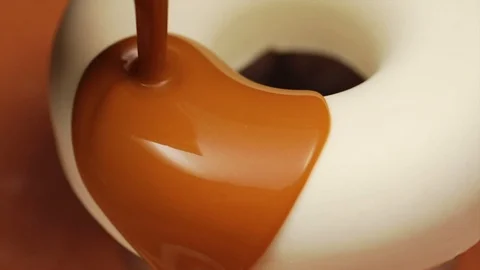 Mousse cake with mirror glaze. A work of culinary art. The process of casting. Stock Footage 101743365