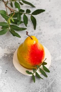 Mousse dessert in the shape of a pear fruit, orange fruit, apricot, lemon and Stock Photos