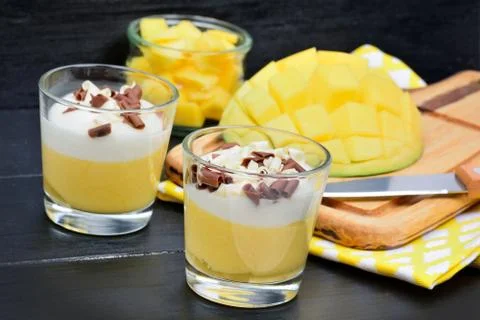 Mousse of mango in a glass jars on table Stock-Fotos