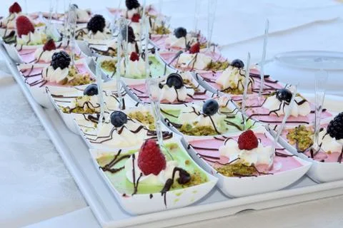 Mousse of various tastes in square cups Stockfoto's