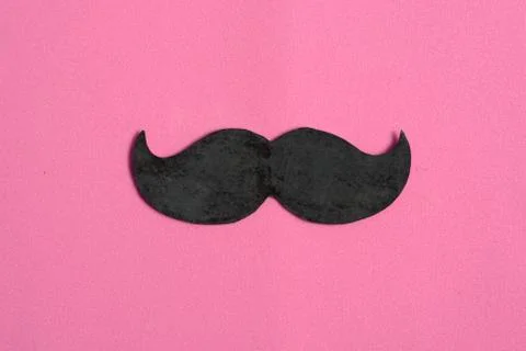 Moustache on pink isolated background, international cancer prostate day conc Stock Photos