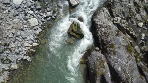 Moutain River Cascading Over Rocks and Boulders Stock Footage 187768874