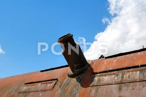 Mouth of the bulk-oil tank on a background of the blue sky with a cloud Stock Photos