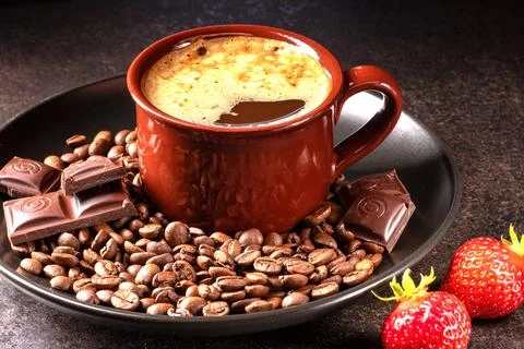 A mouthwatering composition featuring a steaming cup of coffee, fresh strawbe Stock Photos