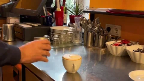 MOV 6-Adding milk to coffee to make cappuccino.Sprinkle cappuccino with grated c Video stock 227702925