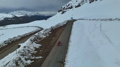 [MOV] From a Red Car Climbing the Valle Nevado Road Stock Footage 344716683
