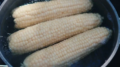 Move back from corn in boiling water Stock Footage 287153501