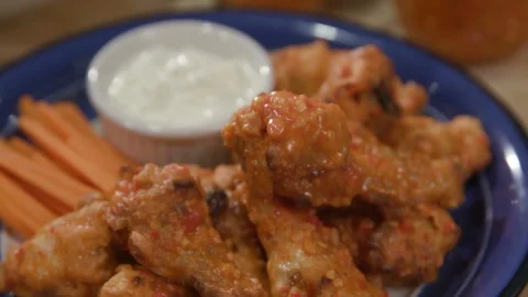 Move Back Over Top Hot Sauce and Chicken Wings Close Up Stock Footage 81276880