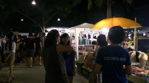 Move between people on the Asian night market, Thailand. Flycam. Stock Footage 34808981